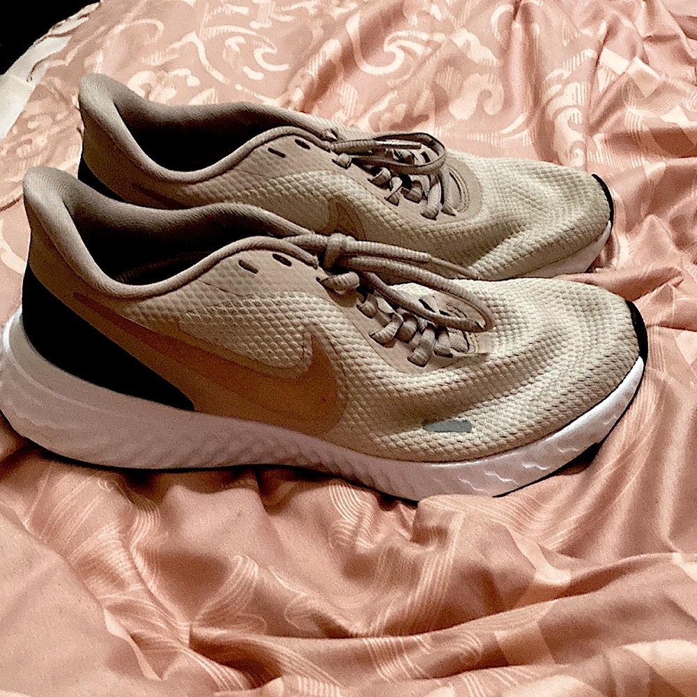 Pink Nike athletic shoes